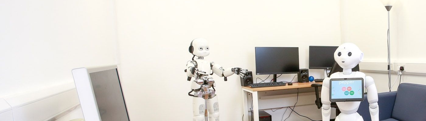 Pair of robots in a computer lab 