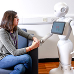 member of staff with a humanoid robot